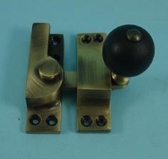 THD104WB/AB Straight Arm Fastener - Black Wood Knob in Antique Brass