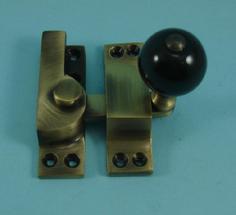 THD104CB/AB Straight Arm Fastener - Black Ceramic Knob in Antique Brass